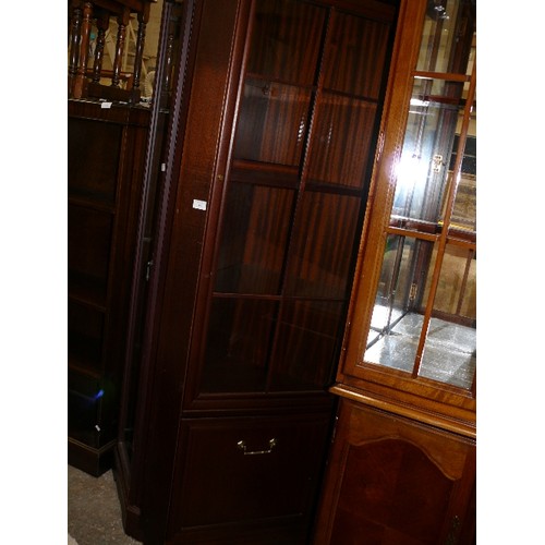 480 - MAHOGANY STYLE SLIM CORNER DISPLAY CABINET WITH GLASS DOORS AND AN UNDER DRAWER.