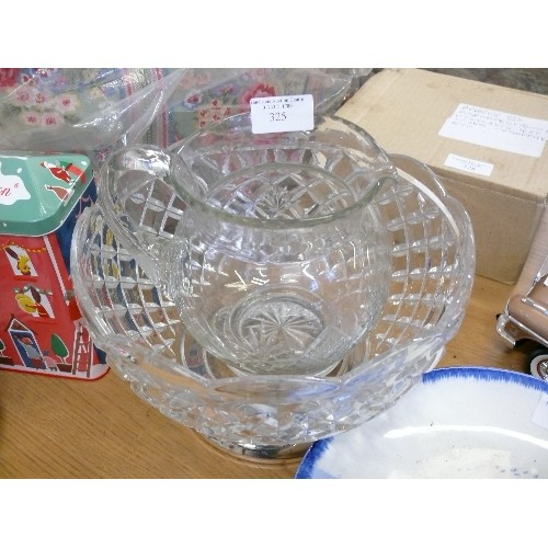 157 - A LARGE VINTAGE MOULDED GLASS FRUIT BOWL ON PLATED STAND AND A CUT GLASS WATER JUG.