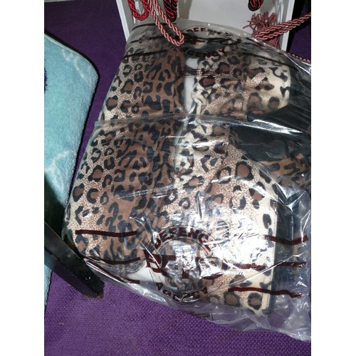 188 - A SELECTION OF LEOPARD THEMED BLANKETS, RUGS ETC.