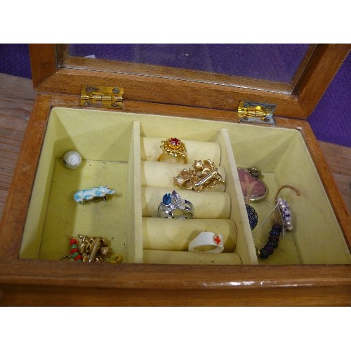 145 - JEWELLERY BOX CONTAINING A FEW PIECES OF COSTUME JEWELLERY.