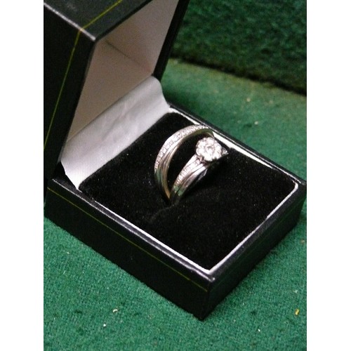 12 - A PAIR OF MATCHING 9CT WHITE GOLD AND DIAMOND RINGS COST £1400 NEW COMBINED WEIGHT 5.9G.