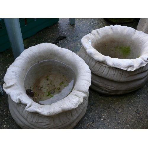 536 - PAIR OF CONCRETE SACK PLANTERS.