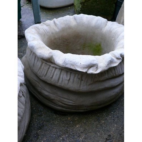 536 - PAIR OF CONCRETE SACK PLANTERS.