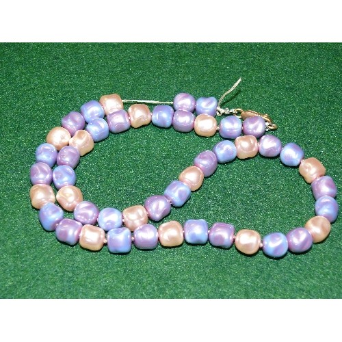 8 - PRINCESS PEARL NECKLACE.  PEARLS ARE COLOURED MAUVE, LIGHT BLUE AND CREAM.