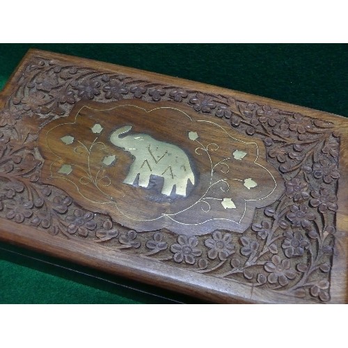 67 - A WOODEN BOX DECORATED WITH AN INLAID BRASS ELEPHANT.