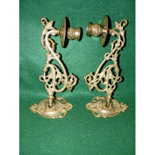 195 - A PAIR OF BRASS PIANO SCONCE CANDLE HOLDERS.