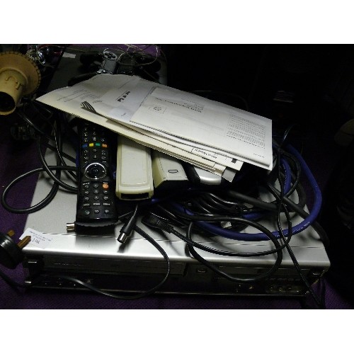 196 - A DAEWOO DVD RECORDER AND VCR DF-4150P PLUS A SELECTION OF LEADS AND REMOTE CONTROLS.