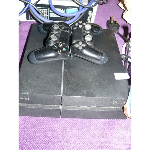 203 - A PLAYSTATION FOUR WITH TWO CONTROLLERS.