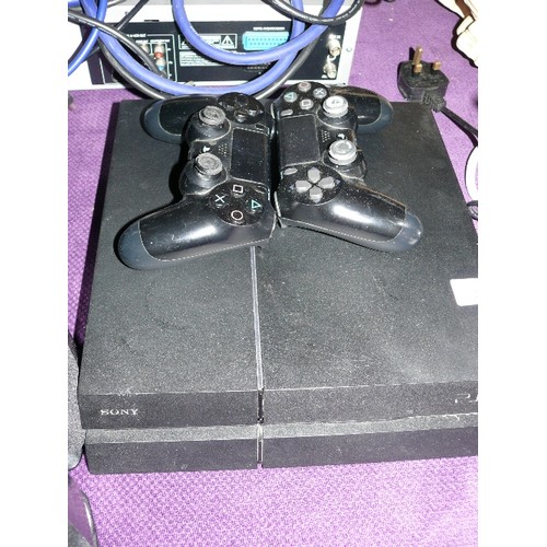 203 - A PLAYSTATION FOUR WITH TWO CONTROLLERS.