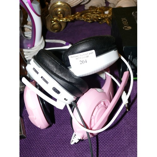 204 - A SET OF TURTLE BEACH HEADPHONES PLUS A PINK SET OF HEADPHONES.