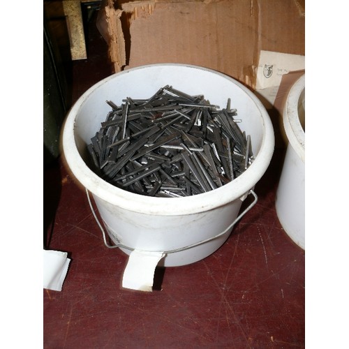 299 - FOUR TUBS OF NAILS AND RAWLBOLTS.