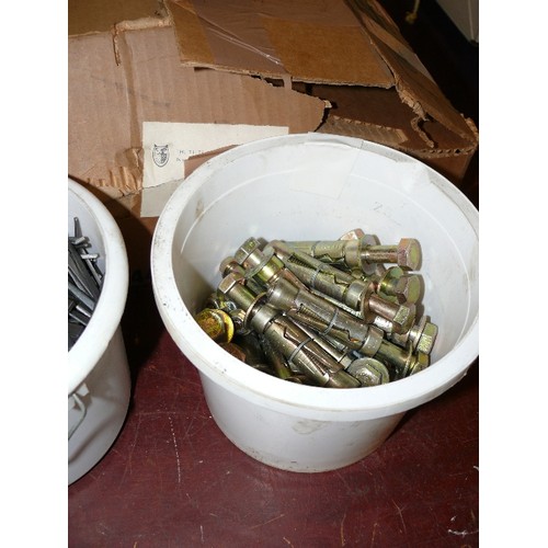 299 - FOUR TUBS OF NAILS AND RAWLBOLTS.