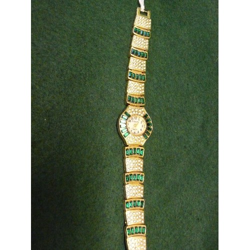 12 - A PIECE OF GOOD QUALITY FASHION JEWELLERY, DESIGNER WATCH IN ART DECO STYLE, GREEN AND WHITE STONES.