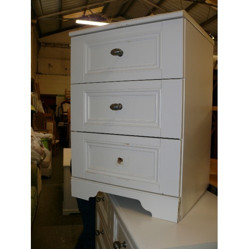 407 - PAIR OF THREE DRAWER BEDSIDE CHESTS IN WHITE, TWO KNOBS MISSING.