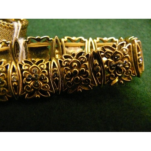 32 - COLLECTION OF THREE GOLD METAL BRACELETS.