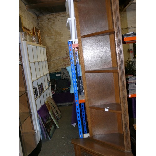 403 - OAK CORNER CUPBOARD WITH DECORATIVELY CARVED FRONT.