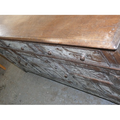 424 - SOLID OAK, CARVED SIDEBOARD WITH THREE DRAWERS AND THREE CUPBOARDS.