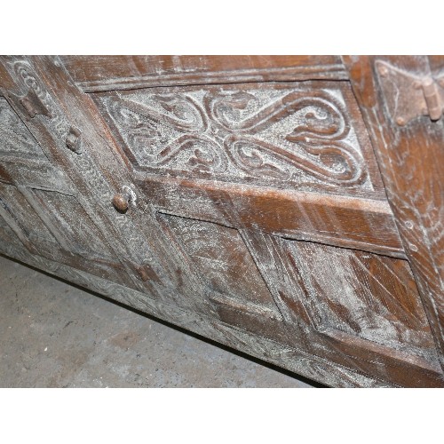 424 - SOLID OAK, CARVED SIDEBOARD WITH THREE DRAWERS AND THREE CUPBOARDS.