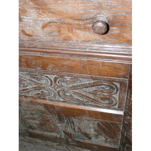 424 - SOLID OAK, CARVED SIDEBOARD WITH THREE DRAWERS AND THREE CUPBOARDS.