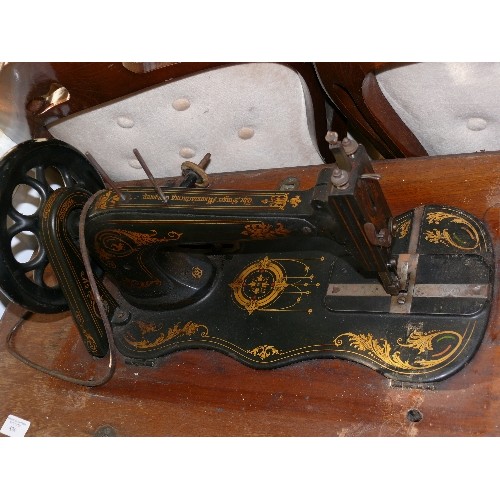 426 - ANTIQUE SINGER SEWING MACHINE, FIDDLE BASE AND CASE ON CAST IRON TREADLE.