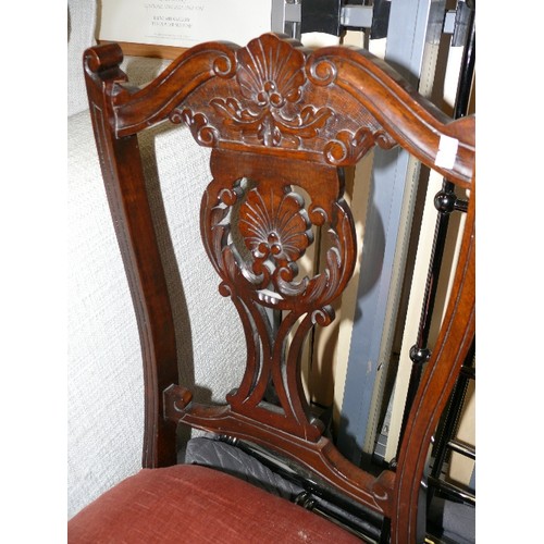 466 - VICTORIAN NURSING CHAIR WITH ORNATELY CARVED BACK ON CASTORS.