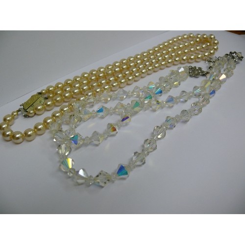 25A - DOUBLE STRAND OF DRESS PEARLS AND A SET OF DOUBLE STRAND CRYSTALS.