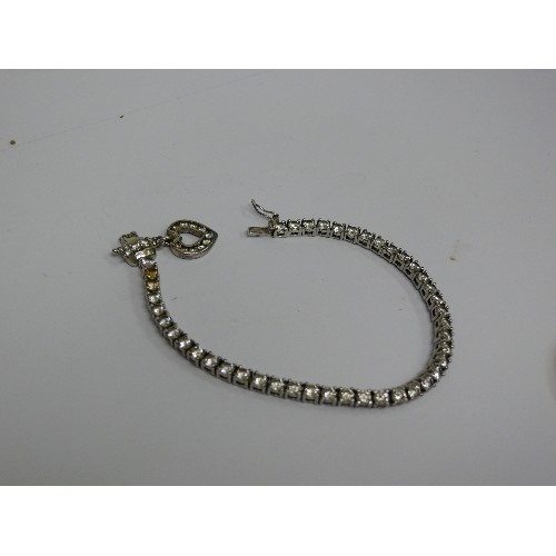 41B - 925 SILVER BRACELET WITH CZ STONES AND A HEART CHARM.