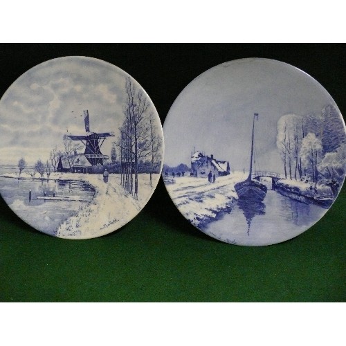 143 - TWO BLUE AND WHITE DELFT WARE PLATES.