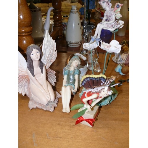 253 - COLLECTION OF FOUR FAIRY ORNAMENTS.