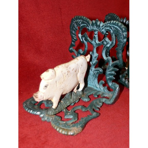 63 - A PAIR OF CAST METAL PIG BOOKENDS.