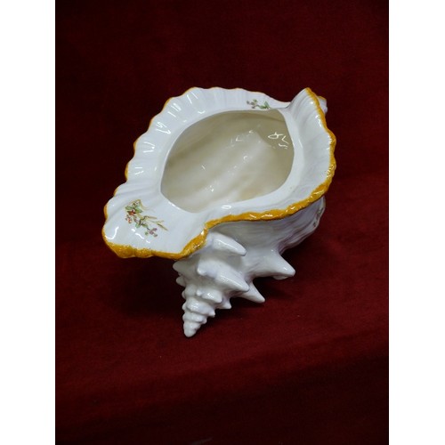 78 - A DECORATIVE CERAMIC CONCH SHELL VASE.