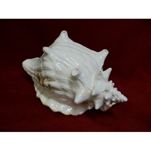 78 - A DECORATIVE CERAMIC CONCH SHELL VASE.