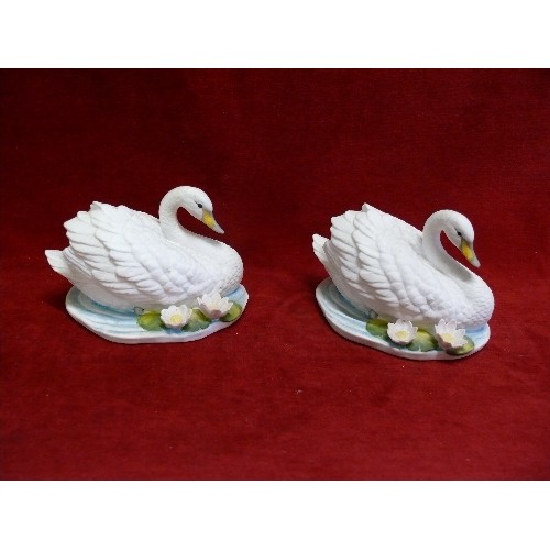 87 - A PAIR OF FINE CHINA SWANS BY ROYAL OSBORNE.