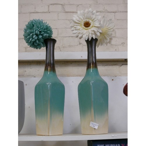 94 - A PAIR OF ATTRACTIVE CERAMIC VASES WITH ARTIFICIAL FLOWERS.