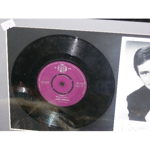 117 - A FRAMED AND GLAZED LONNIE DONEGAN RECORD AND SIGNED PHOTO.