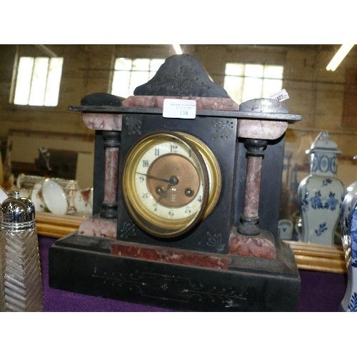 138 - A DECORATIVE SLATE MANTLE CLOCK.