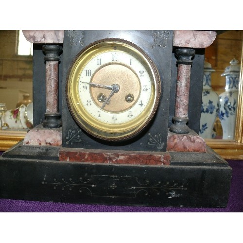 138 - A DECORATIVE SLATE MANTLE CLOCK.