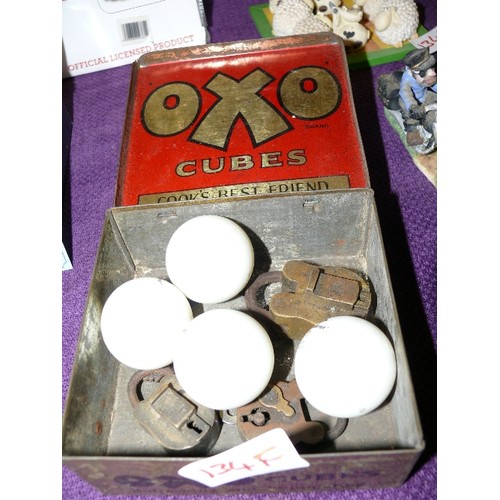 134F - A SELECTION OF VINTAGE PADLOCKS IN A VINTAGE OXO TIN.