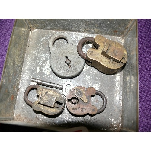 134F - A SELECTION OF VINTAGE PADLOCKS IN A VINTAGE OXO TIN.