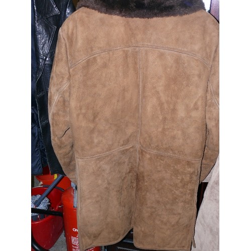 299 - A SHEEPSKIN COAT, NO SIZE GIVEN.