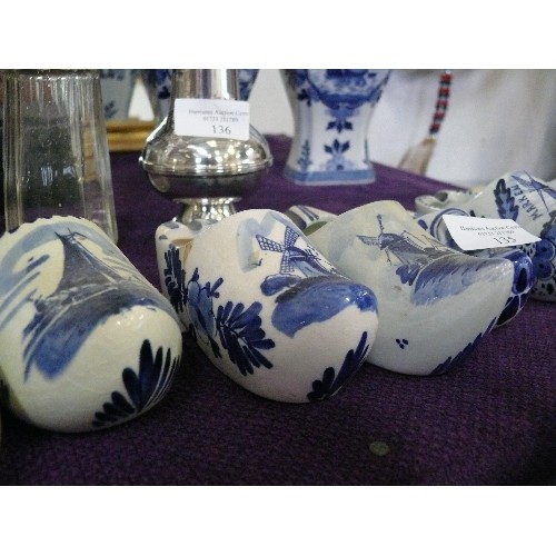 135 - A COLLECTION OF BLUE AND WHITE CERAMIC DELFTWARE CLOGS.