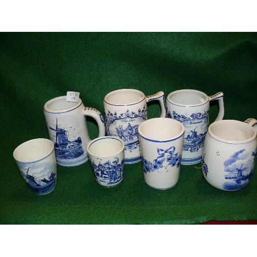 308 - A COLLECTION OF DELFTWARE TANKARDS.