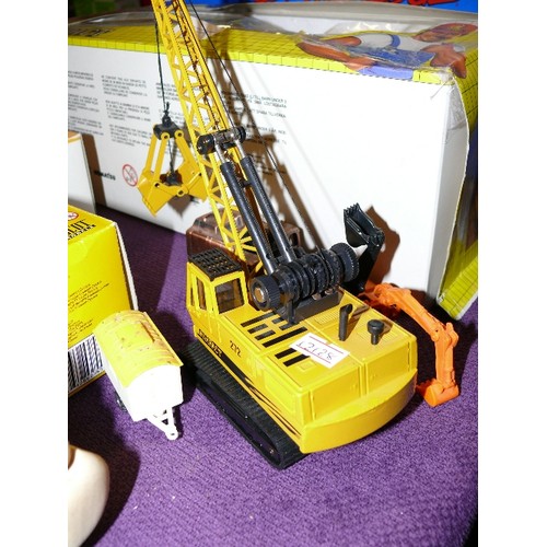 228 - A DIE CAST TOY CRANE BY JOAL PLUS A FURTHER TWO TOY CRANES AND A WORKMAN'S CARRIAGE.