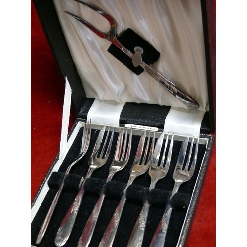 21 - A BOXED SET OF CAKE FORKS.