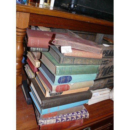 329 - TWO STACKS OF VINTAGE BOOKS.