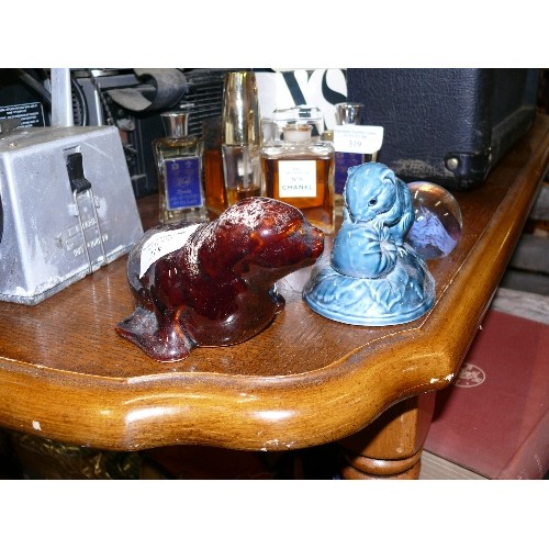 319 - A FIGURE OF A RODENT WITH A NUT BY POOLE PLUS A KERNEWEK POTTERY FIGURE OF A SEAL.