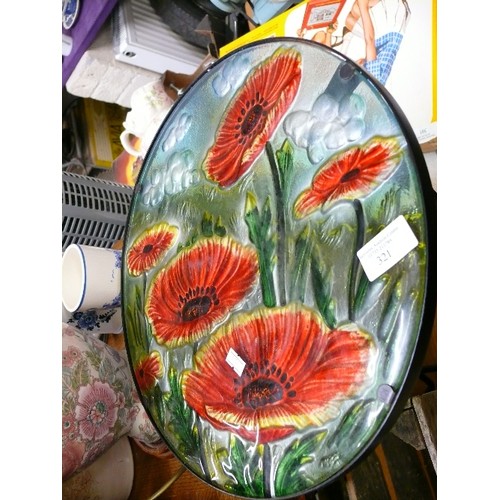 322 - A PAINTED GLASS TOPPED FOLDING TABLE DECORATED WITH POPPIES.