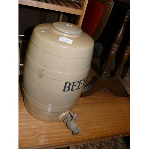 380 - A POTTERY BEER BARREL WITH TAP.