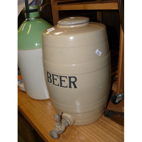 380 - A POTTERY BEER BARREL WITH TAP.