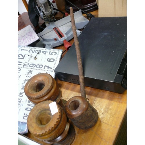 384 - TWO CARVED RUSTIC CANDLE HOLDERS AND A NOVELTY OVERSIZED WOOEN PIPE.